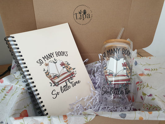 Gift box containing a notebook with the text 'SO MANY BOOKS So little time' and a matching iced coffee glass cup with the same text, both displayed on a piece of tissue paper with 'LIPA' written at the top of the box.